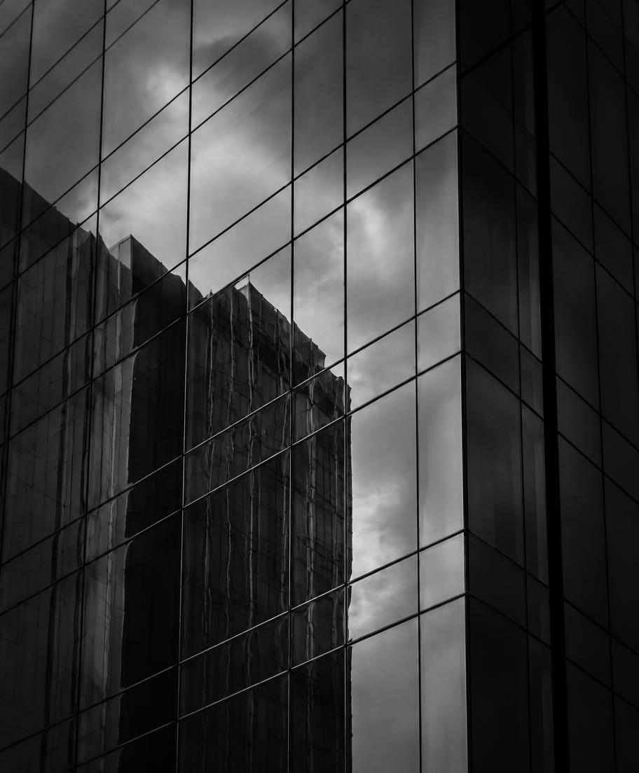 Monochrome glass and steel facade in soft daylight